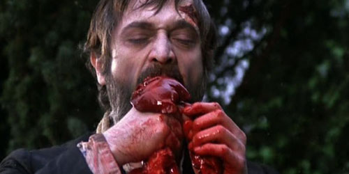 Guthrie (played by Fernando Hilbeck) gets some guts in The Living Dead at Manchester Morgue.
